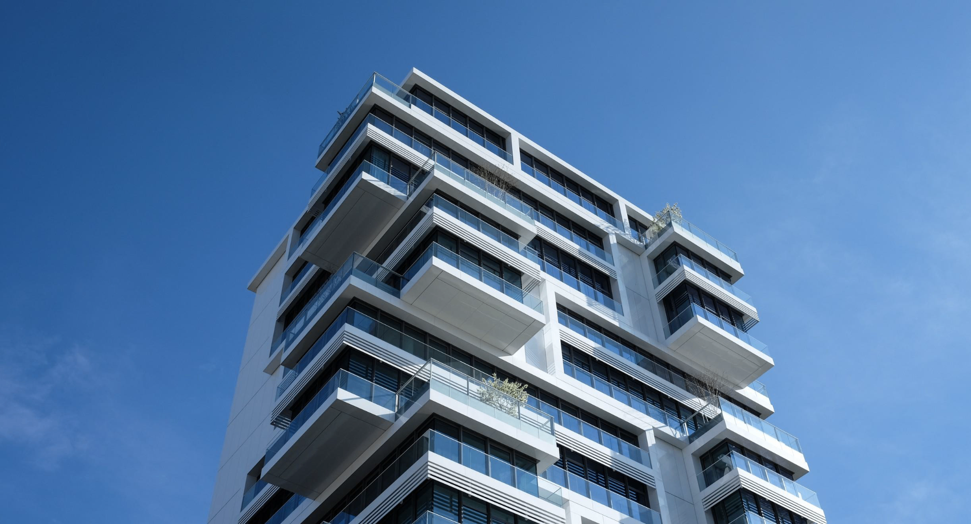 Modern commercial building representing SHAKMA Advisory